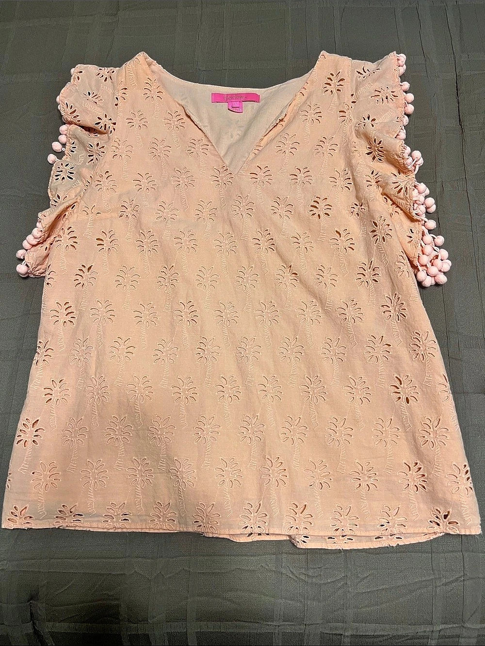 Lilly Pulitzer Astara Top Floral Eyelet Pom-Pom Blouse in light coral color